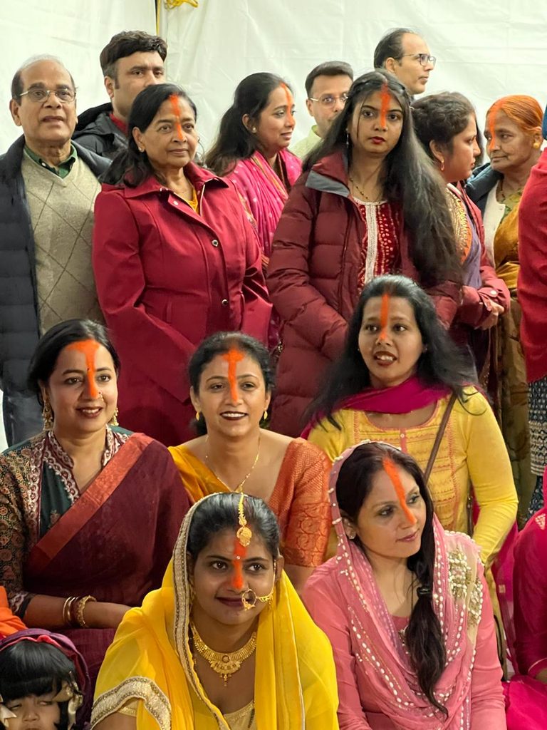 Devotees and families at the celebration.